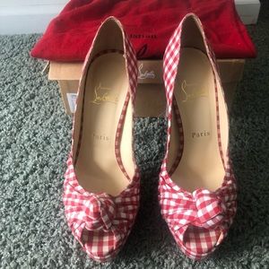 Red and white christian louboutin heels.